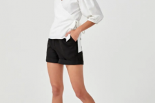 With black shorts and white flat shoes