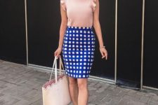 With blue and white checked skirt, beige tote bag and pale pink shoes