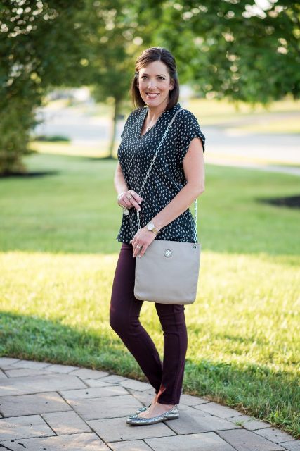 With brown skinny pants, gray chain strap bag and silver flat shoes