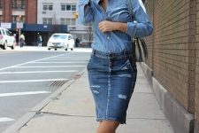 With denim shirt, gray bag and printed flat shoes