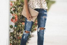 With distressed jeans, beige suede clutch and ankle strap sandals