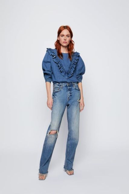 With distressed loose jeans and sandals
