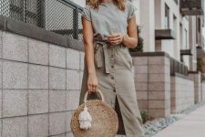 With gray t-shirt, rounded bag and pom pom sandals