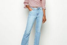 With light blue cropped jeans and beige mules