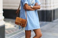 With light blue mini dress and brown bag