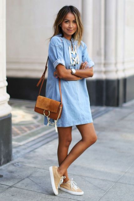 With light blue mini dress and brown bag