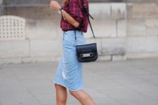 With plaid shirt, black leather bag and black pumps