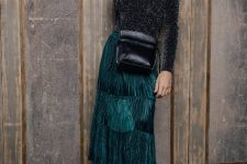 With turtleneck, black leather crossbody bag and black patent leather platform shoes
