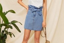 With white ruffled top, rounded bag and lace up sandals