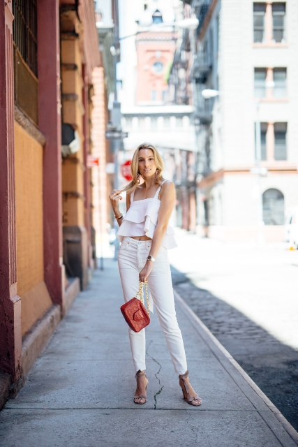 With white trousers, chain strap bag and gray ankle strap sandals