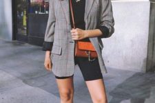 a black tee, black biker shorts, white sneakers, a grey plaid blazer, an amber crossbody bag and layered necklaces