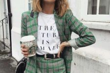 a bold grey and gren plaid skirt suit with a mini, a printed tee, a black belt and a black bag plus statement earrings