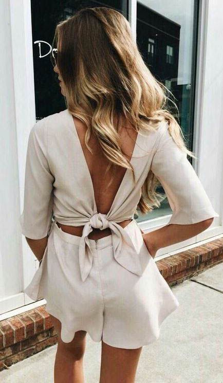 a cool two piece set with a linen crop top with a tied up back and short sleeves and a high waisted mini skirt is amazing