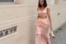 a pink two piece dress with ruffles, a tied up micro top, a ruffle tiered midi skirt and strappy heels for a party