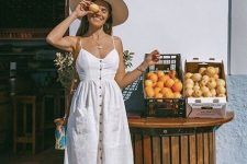 a simple white linen midi sundress on buttons, blue heeled mules, a straw hat and a colorful bag for a cute look