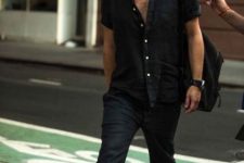 a total black look with a linen short sleeve shirt and pants plus slipons and a backpack is a cool idea