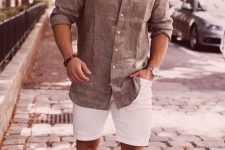 a very simple and stylish summer look with a grey linen shirt, white denim shorts and white sneakers is a cool idea
