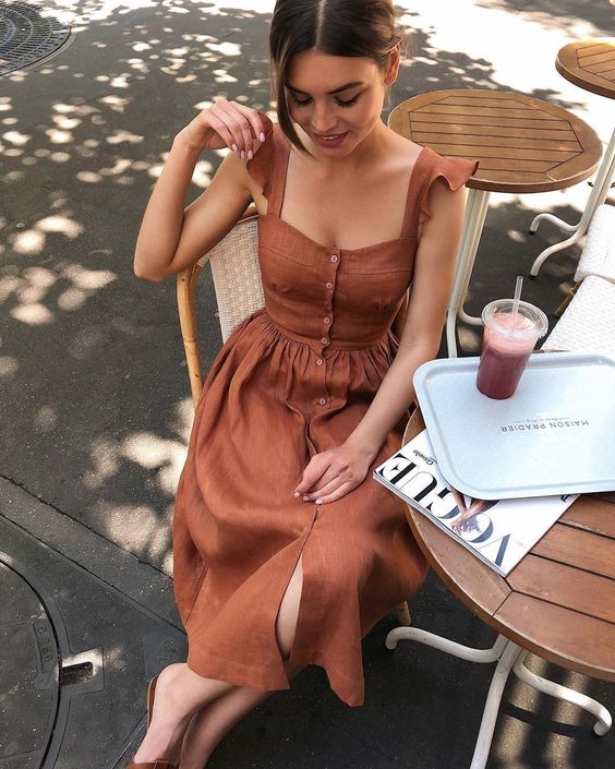 a vintage inspired rust colored linen midi sundress with ruffle straps and buttons is a cool idea for a hot summer day