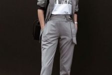 an easy and chic look with a grey pantsuit, a printed tee, a black bag and silver loafers that spruce up the whole look