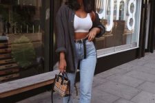 an everyday look with a white crop top, blue high waisted jeans, a graphite grey oversized shirt, a plaid bag and black sneakers