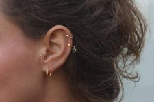 bold boho styling with a lobe, tragus and double helix piercing all done with hoop earrings