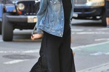 03 a black jumpsuit with wideleg pants, a blue oversized denim jacket, yellow ballt flats for a chic yet casual look