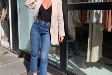 05 a stylish and simple look with a black top, blue cropped jeans, tan ballet flats, a neutral oversized blazer