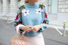 07 a girlish outfit with a blue floral cropped sweater, a pink slip skirt and a pink bucket bag
