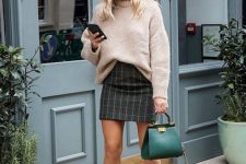 10 a plaid mini skirt, a tan oversized sweater, tan boots, an emerald mini bag for a chic and actual look