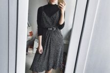 13 a lovely Parisian chic look with a black turtleneck, a printed black slip dress with a belt, black booties for the fall