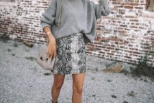 14 a grey snakeskin print mini skirt, a grey oversized sweater, black booties and a gey bag for this fall