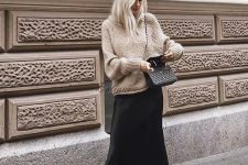17 a fall look with a tan oversized sweater, a black slip midi skirt, snakeskin print booties and a black bag