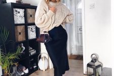 19 a chic fall outfit with a black slip midi skirt, a neutral oversized sweater, brown snakeskin print booties and a red vintage bag