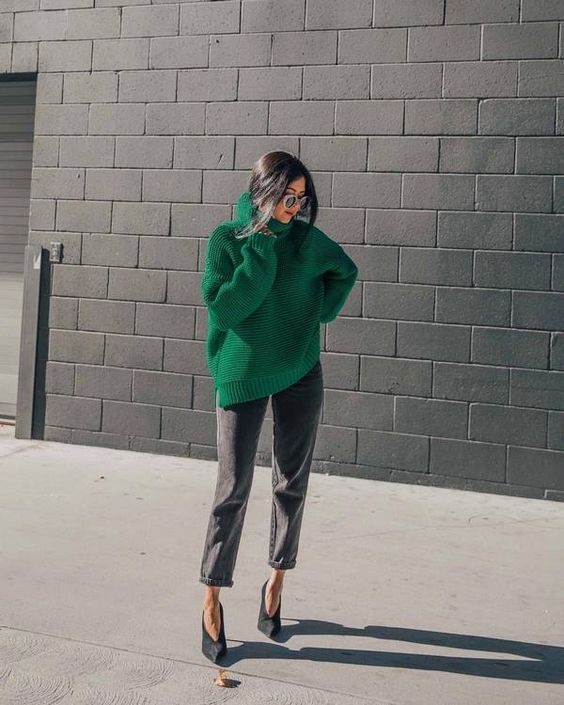 grey cropped jeans, black vintage-inspired heels, an emerald green chunky turtleneck sweater a sa color statement