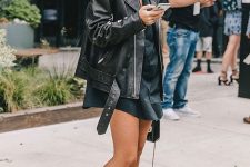21 a black shirtdress, black cowboy boots, an oversized black leather jacket and a black bag for the fall