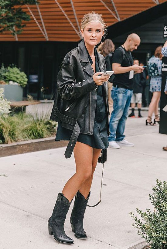 a black shirtdress, black cowboy boots, an oversized black leather jacket and a black bag for the fall