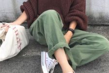 21 a brown chunky knit oversized sweater, green wide leg jeans, white sneakers and a white tote