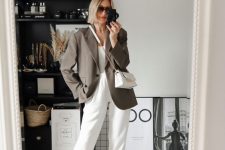23 a white top, white joggers, white sneakers, an oversized grey blazer and a white mini bag for a comfy fall look