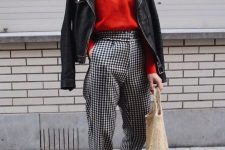 26 a Parisian chic look with a red top, plaid high waisted trousers, a black leather jacket, silver ankle strap shoes and a tote