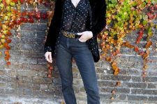 27 a black polka dot shirt, a black velvet blazer, grey jeans, a logo belt and gold boots for a chic look