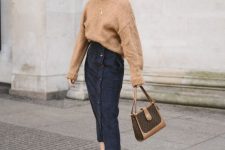 31 a tan oversized sweater, a navy button up denim midi, snakeskin print booties and a two tone bag