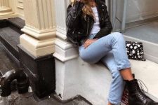 37 a timeless look with a white tee, blue jeans, a black leather jacket, black combat boots and a printed bag