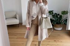 39 a neutral work outfit with a white shirt, tan trousers, an off-white trench, creamy combat boots and a creamy bag