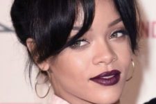 Rihanna wearing a top knot and elegant curtain bangs looks amazing, this is a chic and timeless look