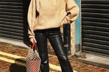 With beige turtleneck sweater, fishnet bag and black suede ankle boots