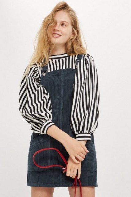 With black and white striped blouse and red bag