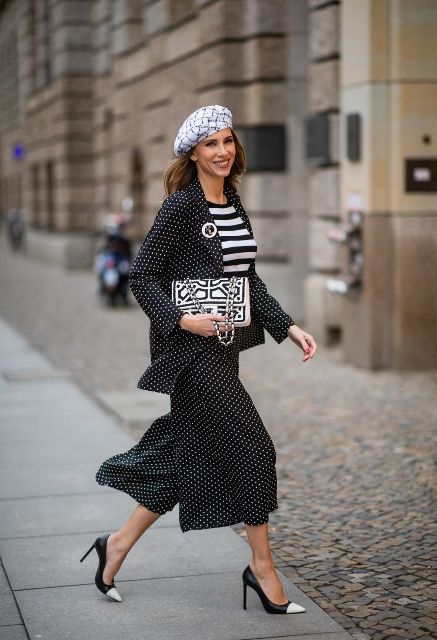 With black and white striped shirt, printed beret, printed chain strap bag and black and white pumps