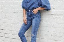 With distressed skinny jeans and black low heeled shoes