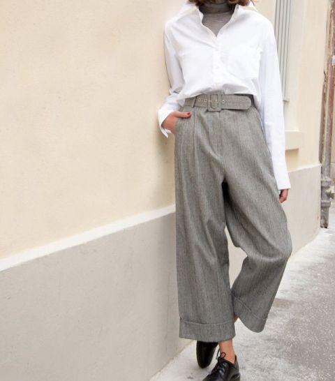 With gray turtleneck, white button down shirt and black lace up flat shoes