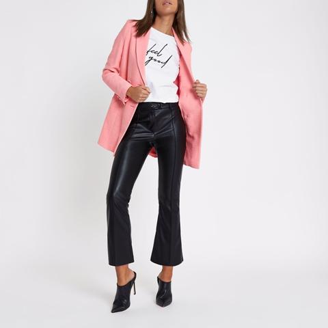 With labeled t-shirt, pink blazer and black heeled mules